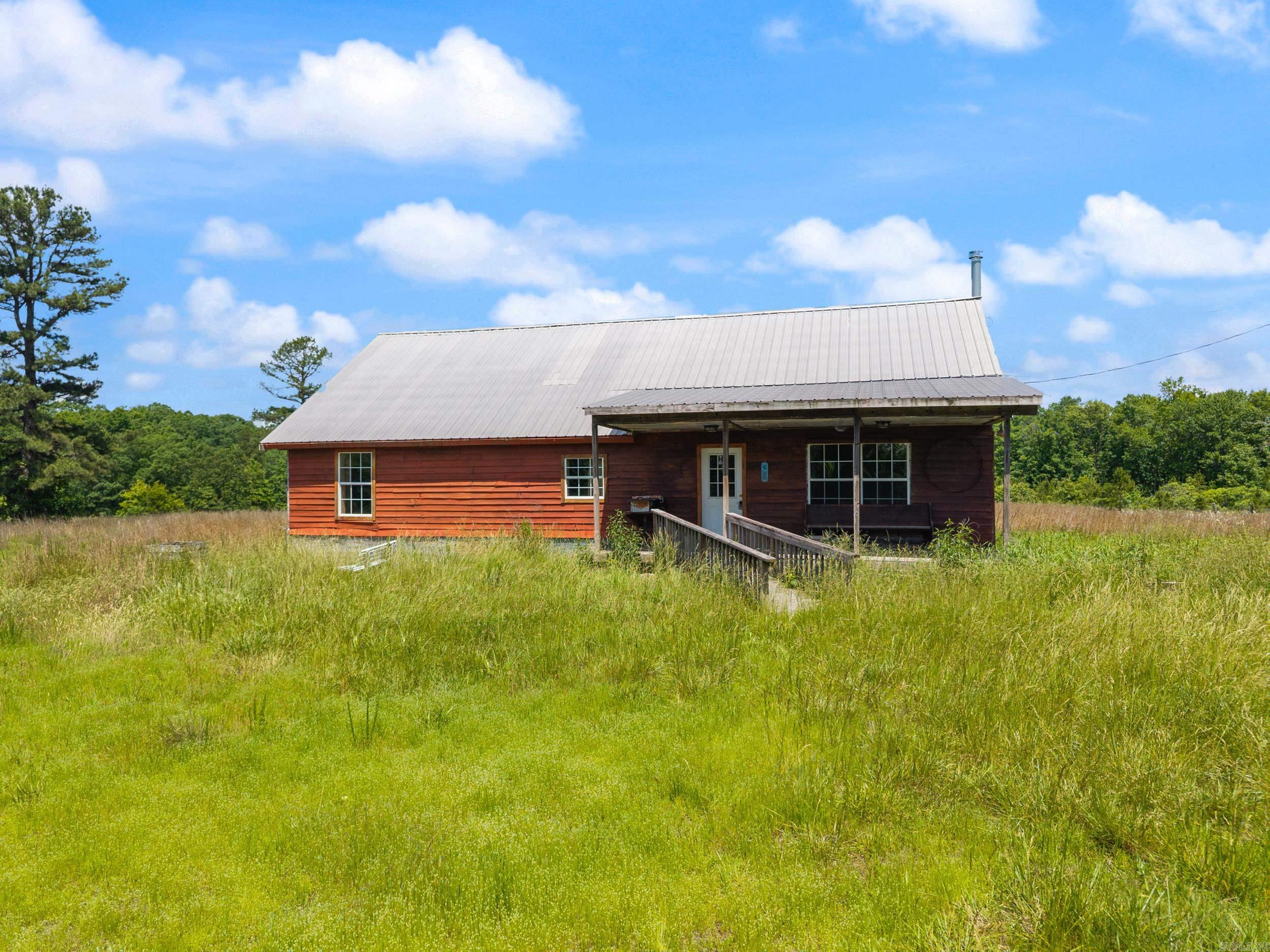 Rustic Retreat in the Ozark Mountains! Located on 120 Acres in Jerusalem, AR Discover the perfect blend of acreage and adventure with this diamond-in-the-rough property tucked away in peaceful Jerusalem, Arkansas. Sitting on 120 sprawling acres of timber, pasture, and wildlife habitat, this home offers endless possibilities for hunting, hiking, or simply escaping the hustle and bustle. Comfort where it counts ā Two efficient mini-split units provide both heating and cooling year-round, and a cozy wood-burning stove in the living area. A durable metal roof means years of worry-free protection from the elements. Home has 3 bedrooms, a small office, and a bonus area upstairs. Your private playground ā With 120 acres at your disposal, imagine trails for riding ATVs, areas for planting food plots, or secluded spots for a weekend hunting camp. Whether youāre looking for a private weekend getaway, or a working homestead, this property delivers on space and potential. Donāt miss your chance to breathe easy on 120 acres of Arkansas countryside! Agents see remarks