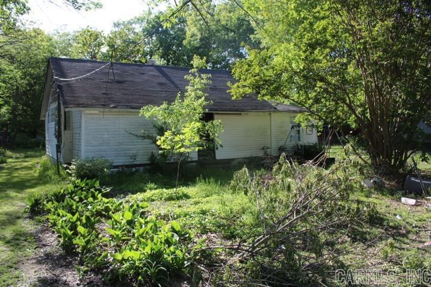 Older home fixer upper in town.  No Disclosure. To be sold as is.   Agents see confidential remarks and docs online for more information and offer submission.  call 501 568-5652 to schedule showings.