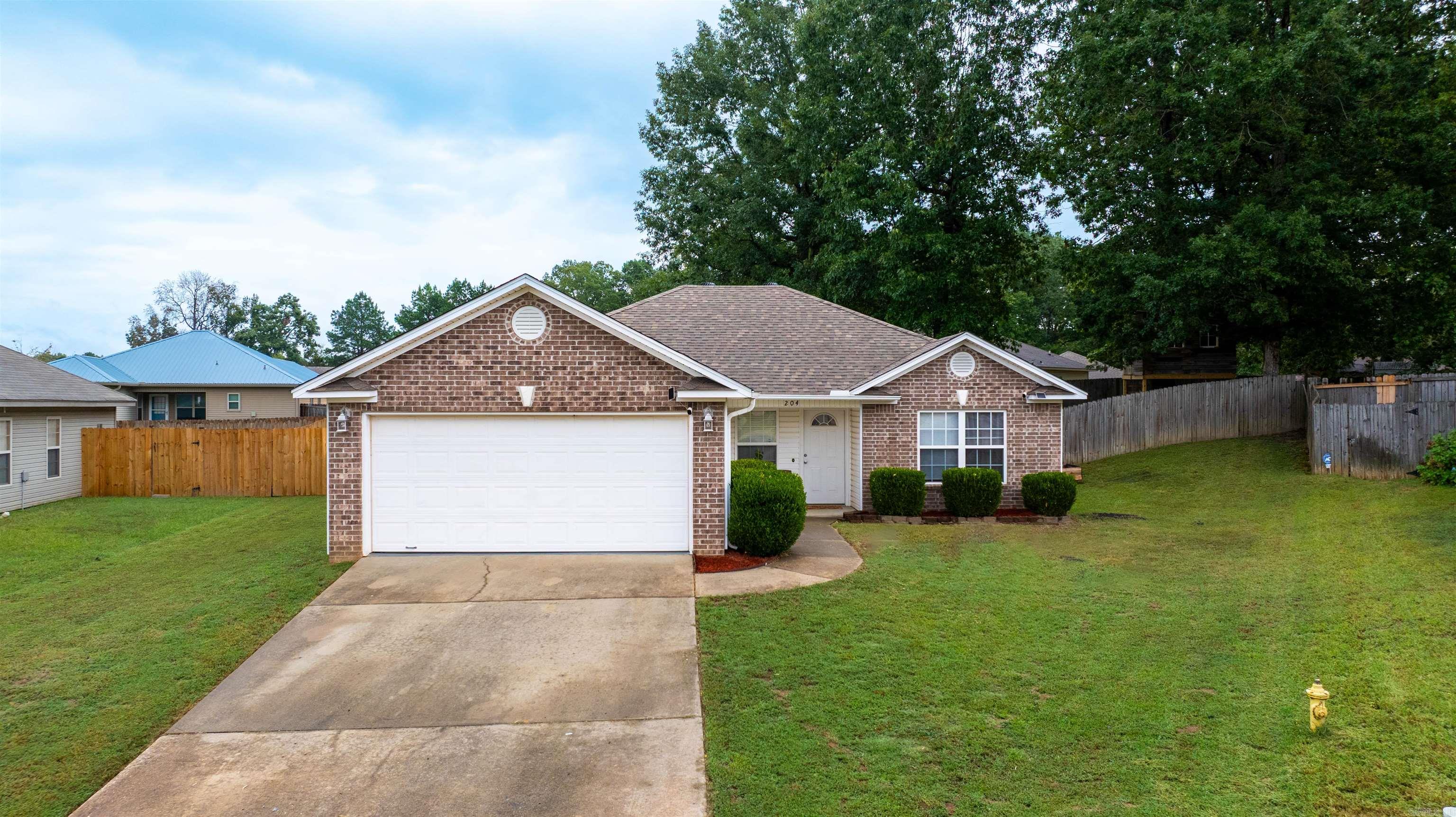 Welcome to Wild Ivy Cove! Come check out this amazing home in a cul-de-sac of the Wildwood Subdivision just off of the Benton Parkway. As you walk into the home you will find a open floor plan where the kitchen flows seamlessly to the living room with vaulted ceilings. On the left side of the home you will find the primary suite and on the right side you will find the 2 guest bedrooms with the guest bathroom. In the spacious back yard you will have plenty of room to stretch and play. Including an amazing treehouse. Roof less than 2 years old! Schedule your showing today!