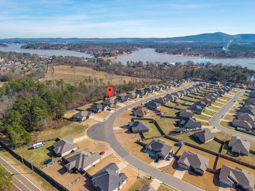 Your Family will Love calling 149 Cambridge Drive "Home"... featuring 11' Ceilings and Beautiful LVP Flooring in the Living Room, a Spacious Dining Area with Extra Room for a 2nd Sitting Area or Book Nook! The Kitchen is equipped with Natural Wood Cabinetry, Granite Counters, a Double Oven and Walk-in Pantry! Enjoy a Split Floor Plan and Great Storage! This Home Lives Well and the Screened in Porch overlooking the Fenced Back Yard and Woods Beyond is Everyone's Favorite! In Addition to the 2 Car Garage, the Driveway is Oversized with additional Parking! Storage Building Coveys. New HVAC. The Roof and Siding is 2 years old. Call your Favorite Realtor for a Tour!