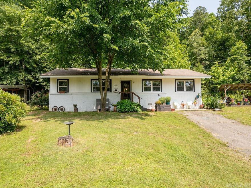 This delightful 4-bedroom, 2-bathroom home offers a harmonious blend of vintage character and modern amenities, situated just minutes from the heart of town. Inside, you'll find new flooring throughout, enhancing the home's fresh and inviting atmosphere. The spacious kitchen has been thoughtfully updated with modern finishes, while still preserving its vintage charm with a classic stove that adds a nostalgic touch. The primary suite features a luxurious soaking tub, ideal for relaxing after a long day. Additional updates include a new water heater, ensuring comfort and efficiency. Whether you're enjoying the cozy living spaces or the inviting outdoor areas, this home offers a warm and welcoming atmosphere that seamlessly blends the charm of the past with the conveniences of today.