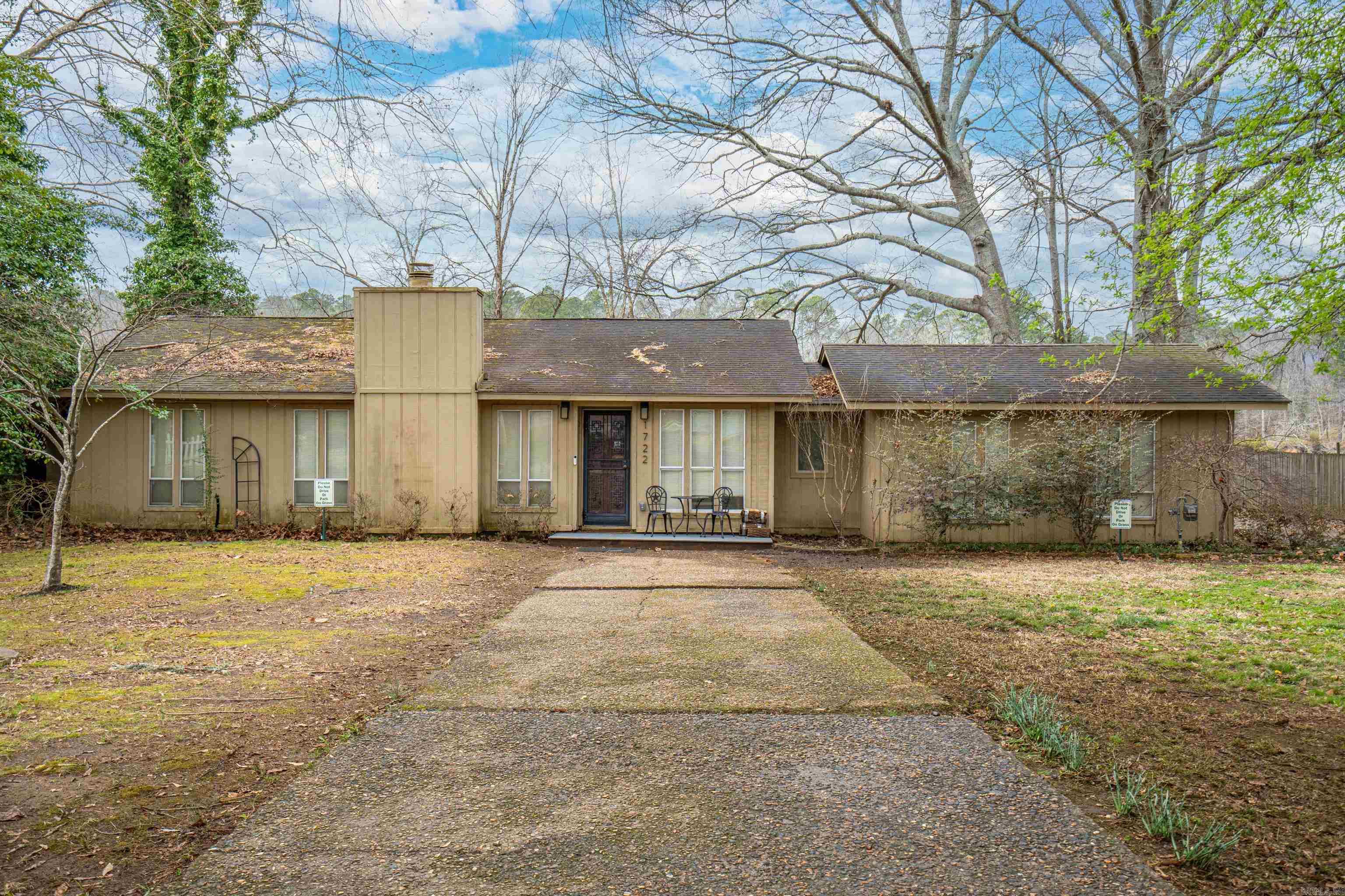 This affordable lakefront home on Lake Hamilton features three spacious bedrooms and two modern bathrooms, ideal for families or guests. The open-concept living area is accentuated by elegant granite countertops in the kitchen, providing a stylish space for cooking and entertaining. Through the kitchen is the sought after Arkansas Room for year round panoramic lake views as you step outside to enjoy the inviting outdoor seating area. The fenced yard ensures privacy and safety for pets and children, while the sea wall adds a touch of sophistication and peace of mind against erosion. The property also includes a two-car garage, providing ample space for vehicles and storage. . FULLY FURNISHED and ready to move in, this home is a true gem on Lake Hamilton, offering both luxury and convenience for a lakeside lifestyle. As an active STR, the next owner can enjoy income property or maintain a warm lakeside retreat for themselves.