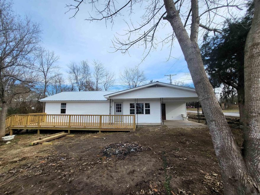 Discover your dream home just 3.8 miles from Baker Ford Access on the Buffalo National River in Saint Joe, Arkansas. This remodeled gem sits on 4 lots & features new heating & cooling, blown insulation, new windows, front door, metal roof, vinyl siding, laminate flooring, fresh paint, appliances & kit cabinets, pex plumbing, electrical, repaired foundation & an open floor plan with a Wild Cherry pass-thru. The 2 bedrooms & 1 bath offer comfort, complemented by a large yard (which the owner will finish seeding & cover the new septic) & a new front deck. Additional perks include an outdoor building for workshops, storage, or a she/he-shed, all set against the backdrop of the Buffalo River's family-friendly activities. With 932 sq ft & proximity to Harrison's amenities, this property is not just a home; it's a potential nightly rental opportunity for the adventurous. Rent it out to others when you are not here. Don't miss out—schedule a viewing today and make this beautifully remodeled home practically at the river yours today!