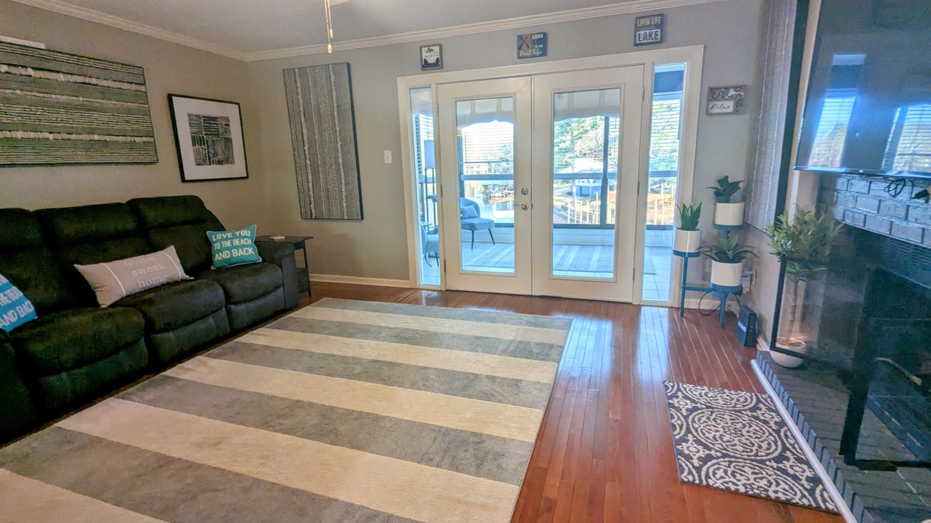 Located in Westport Bay less than a minute from the MLK Bypass off Airport Rd. This updated, FURNISHED, Lake Hamilton condo could be a fun getaway for weekends or for comfortable full time living. The glassed in sunroom is heated and cooled for year round enjoyment. The living and dining areas are spacious and well designed. The fireplace completes the ambiance with it's remote controlled electric fireplace insert which also has a heater function. The master bedroom has a large ensuite bathroom and there are roomy double walk in closets. The updated kitchen has all the expected amenities and there is a handy coffee/wine bar closer to the living area. The large hall bathroom and second bedroom complete the condo. Westport Bay is located just off the main channel of Lake Hamilton and the owners covered boat stall doesn't get the main channel wave action. There's also a swim dock and two outdoor gathering areas as part of the common ground amenities. Park your car in the assigned covered carport and note that there is plenty of guest parking spots available as well. This is a really good price for a 2/2 gated condo with a boat stall. Locking outdoor storage room by front door.