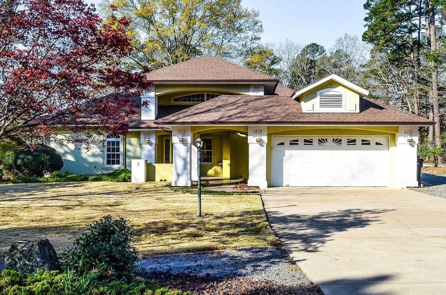 Level corner lot across from Lake Balboa... Bonus lot included makes this a bit over an acre. Own your own "park". Stunning 3 bedroom split floor plan plus office and 2.5 bath home.  Recent updates include new carpet 2026, freshly painted 2026,HVAC 2023 & 2025, roof 2024 Large covered patio area with automatic screens-2023, sprinkler system for landscaping with wandering walking paths throughout the planting areas. Buried propane tank for gas back-up system for HVAC, water heater and fireplace. Other updates include microwave-2025, range-2024 and disposal 2024.Hot Springs Village Property Owner Association has a new member buy-in fee of $2,000.00 due and collected at closing.