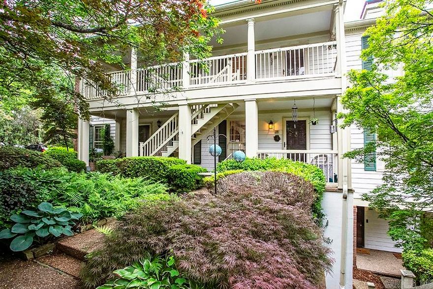 This stunning, ground-level two-bedroom condo features thoughtful updates throughout, including designer lighting and custom built-in bookshelves. The interior is anchored by a cozy fireplace with new gas logs, while the kitchen and bath have been tastefully modernized. Enjoy the versatile enclosed back porch—perfect as a sunroom—or relax on the front porch overlooking an incredible, tranquil landscaped courtyard.