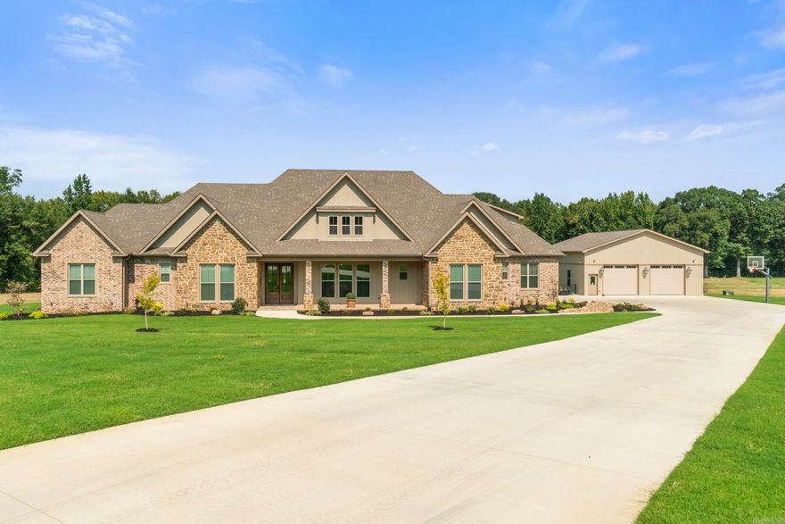 Discover the perfect blend of luxury, space, and privacy in this stunning 5-bedroom, 4-bath traditional-style home on 4.4 acres in a beautiful gated community just minutes from downtown Searcy. Ideal for those who value peace, privacy, and convenience, this estate features a serene pond, a 3-car attached garage, and an incredible secondary garage/workshop with two oversized overhead doors—large enough for RVs—with a full kitchen, laundry, and bath, easily convertible into a separate apartment or guest house. Inside, enjoy two fireplaces (one in the sunroom, one in the main living room), spacious bedrooms—including the master on the main floor—and thoughtful details throughout. With horses and cattle allowed, high-speed internet, and proximity to the airport (perfect for private flyers), this is a rare opportunity to live rurally without sacrificing access. Only 7 minutes to downtown Searcy and 40 minutes to Little Rock. Homeschool-friendly and ideal for remote work or travel-based lifestyles.