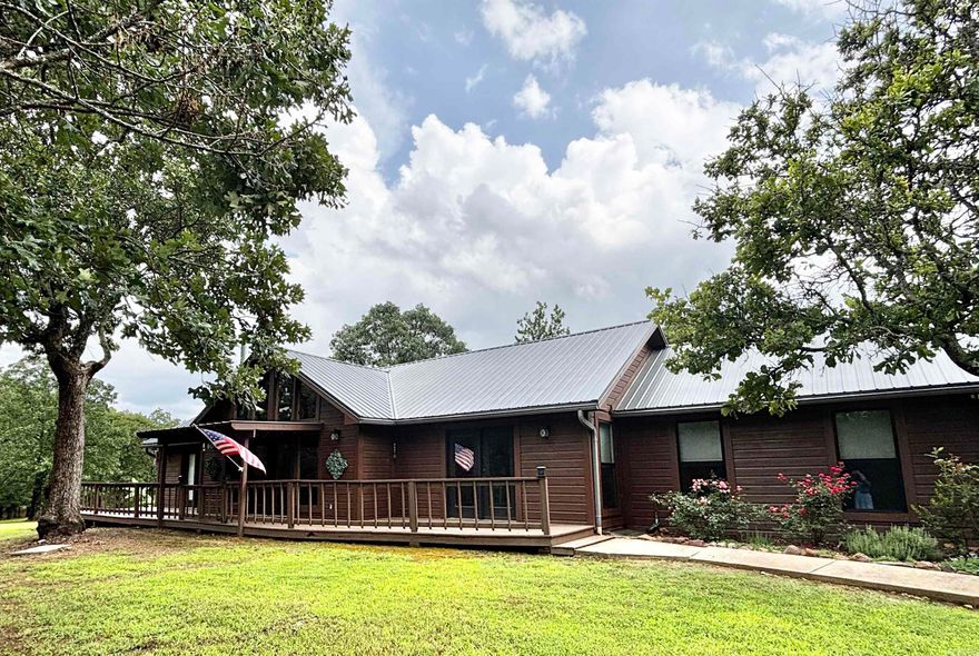 Escape to peace and privacy in this charming 2-bedroom, 2-bathroom home nestled on almost 10 acres. Perfectly blending rustic charm with modern comfort, this property welcomes you with an open-concept living space anchored by a cozy wood-burning stove—ideal for chilly evenings!  The kitchen is a true highlight, featuring granite countertops, ample cabinetry, and an easy flow into the living and dining areas—perfect for entertaining or quiet country nights in. Both bedrooms offer comfortable spaces with natural light, and the two full baths make everyday living convenient for residents and guests alike.  Outside, there's room to roam, garden, explore, or just soak in the tranquility of your own slice of nature!