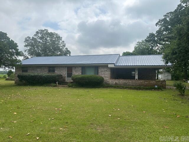 A little TLC is needed! Sitting on approx. 1.5 acres outside the city limits. This brick home offers over 1,600 sq ft, 3 spacious bedrooms. Large kitchen/dining area, laundry room/mudroom has 1/2 bath. Call today to see this one