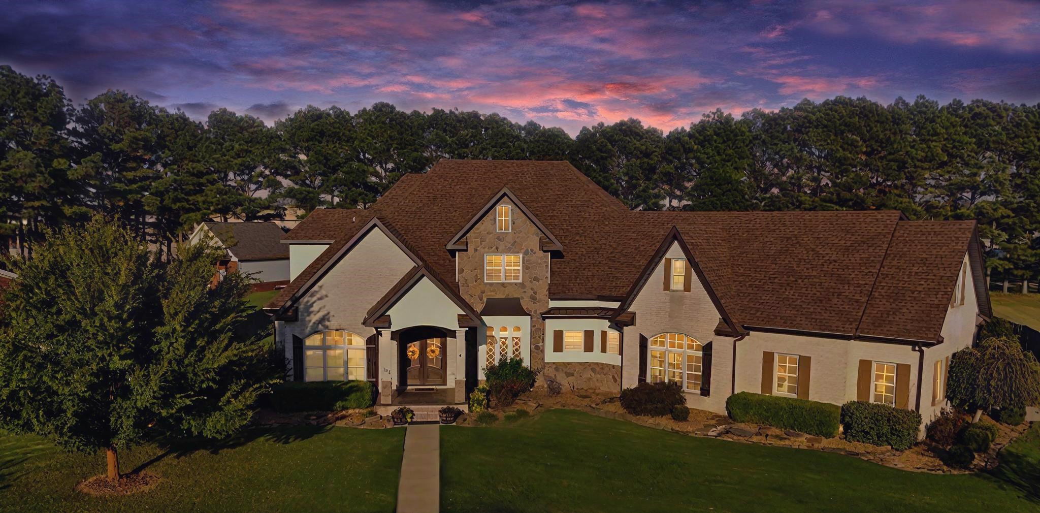 Welcome to your dream home! This magnificent custom designed 6,100 +- sq ft residence is nestled in a wonderful family-oriented subdivision, offering an abundance of space, luxury, and modern amenities. This stunning property features 5 bedrooms, 4.5 bathrooms, two living areas, and two fireplaces, all situated on a large lot. The interior boasts an open concept design, perfect for modern living and entertaining. The kitchen is a chef's delight with two islands, a large pantry, and an eat-in area. There is a formal dining room that can be converted into a music room, as well as a convenient office for remote work or study. Entertainment options abound with a movie and game room, while ample storage space, including a third level storage area, ensures all your belongings have a place. Exterior highlights include a 16x20 shop for hobbies or additional storage, a storm shelter for safety during severe weather, and a three-car garage providing plenty of parking space. The large screened-in back porch is perfect for outdoor enjoyment, and the beautifully designed exterior boasts exceptional curb appeal. This home has many intricate details that you must see in person to fully appreciate