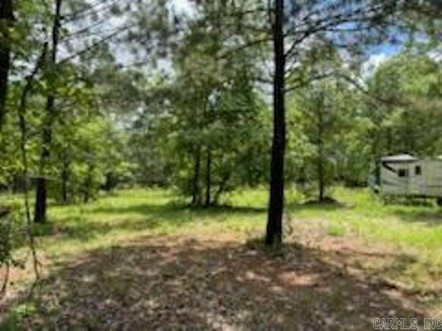13.232 acres with utilities; well water, septic system installed and electricity is hooked up.  Located right outside of Nashville, AR.  You can be on Main Street in around 5 minutes.  Do not miss out on this great parcel of land, that is ready to move onto.  **Camper does not convey with property.  **Survey on file **Acreage is taken from 2018 survey.
