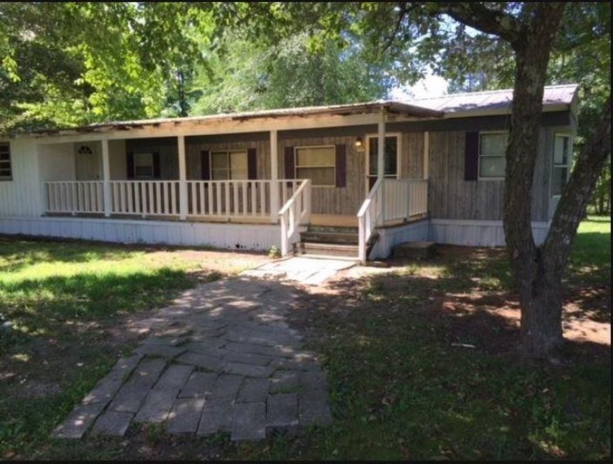 2 bedroom, 1 bath mobile home on a nice 1 acre lot with shade trees and mountain views within walking distance from Lake Wilhelmina.