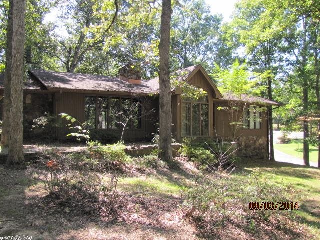 Tremendous opportunity on a large custom home in the Timber Trails subdivision! Home has 2252 sq. ft. on ground floor with 3 bedrooms and 2 baths. Custom tile in kitchen, large dining room and family room. Family room is rustic with vaulted ceiling and rock fireplace. There is a large heated and cooled sunroom on the rear of the house that is perfect for indoor plants. Bedrooms on main floor have hard wood flooring. Master bath has a large garden jacuzzi tub with marble flooring, in addition to a