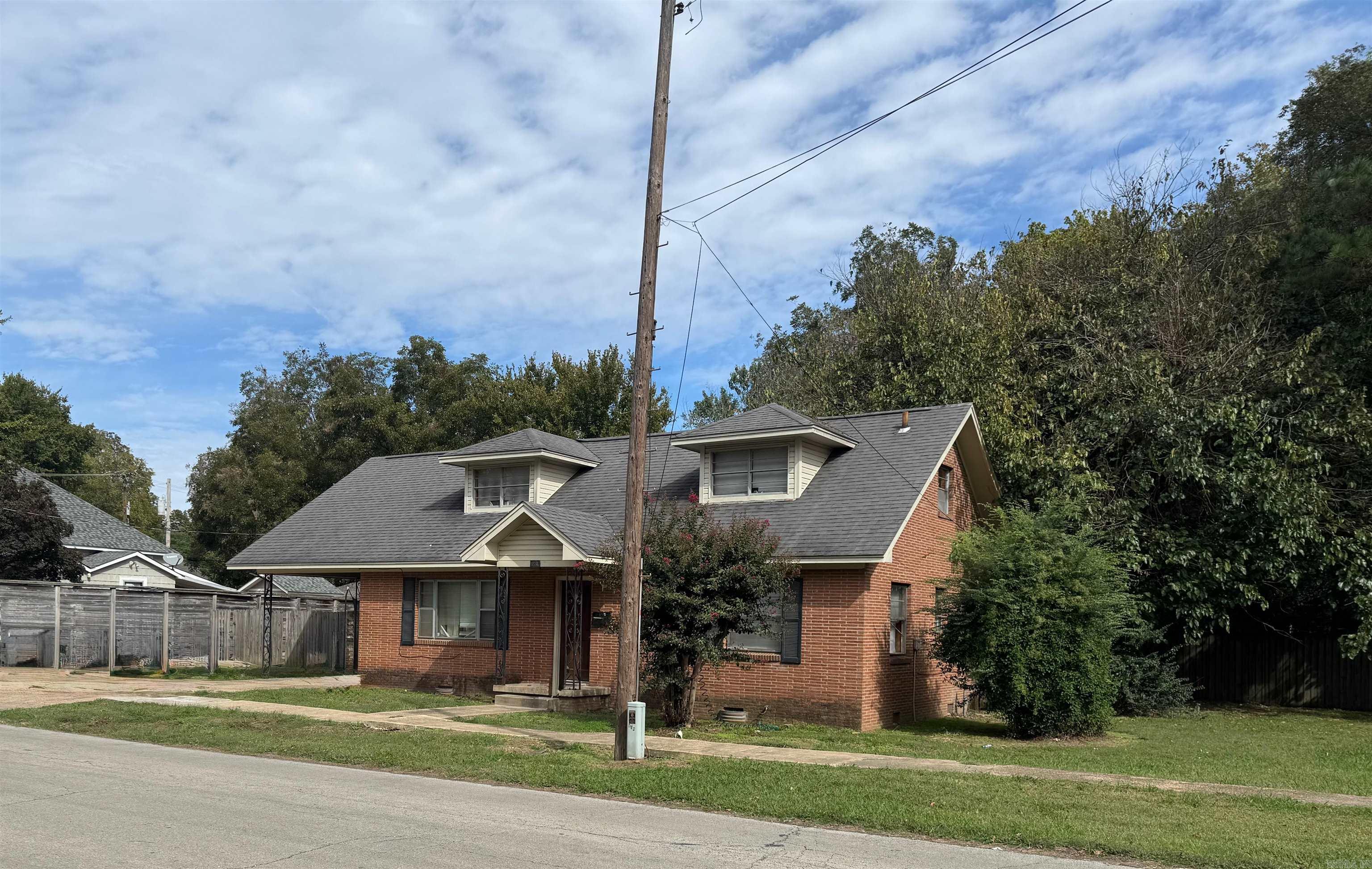 This spacious 2 story brick home has 4 bedrooms, 2 baths, hardwood flooring, & an open floor plan with a breakfast bar. The sewer line has been replaced within the last couple of years. There is a small backyard area with a patio perfect for cookouts and a large side yard which would be great for kids or pets to run around. It is currently rented for $1100 with a long term tenant.