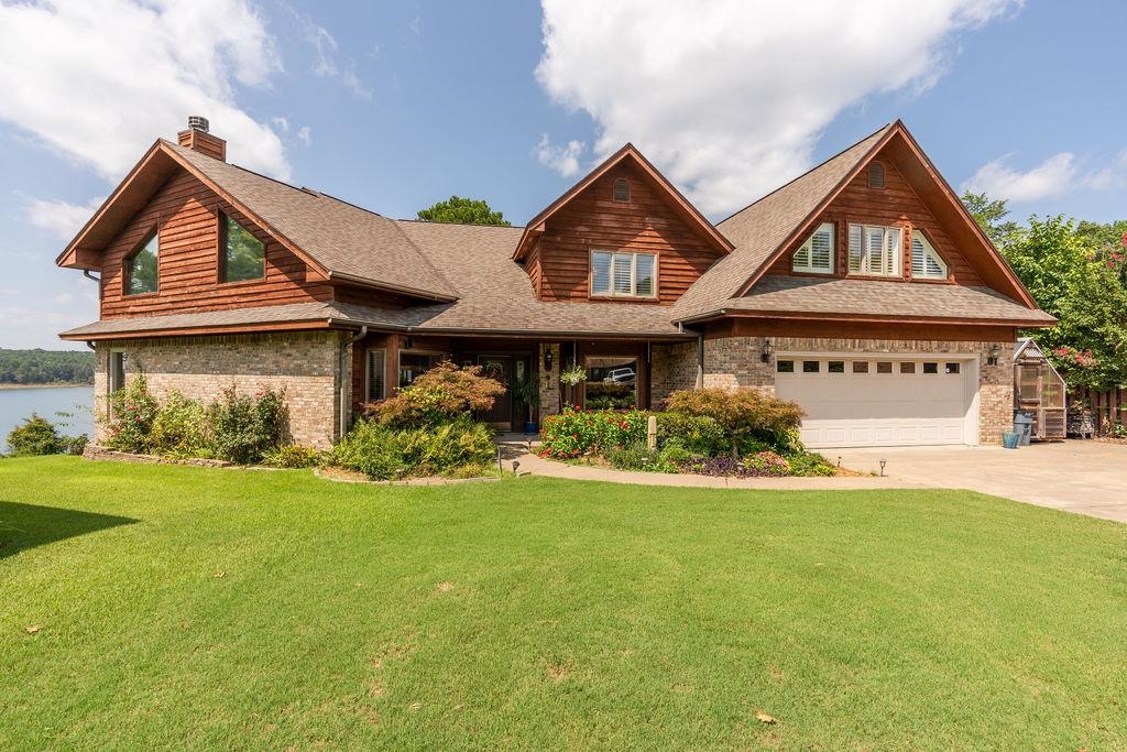 Exceptionally well built house overlooking the spectacular waters of Greers Ferry Lake. West facing decks provide one of the best sunset spots on the lake! Soaring vaulted ceilings in the great room with more views of the big water. Huge upstairs suite with it's own elevated deck for even more dramatic lake views. Access to the water just a few steps out the back door! Located in a wonderful neighborhood that is close to everything in town but with a resort feel, minutes from marinas, golf, and world class trout fishing on the Little Red River. Wood burning fireplace to take the chill off and your own greenhouse for year-around cultivation. Chef's kitchen, lots of storage and lovely flower beds.
