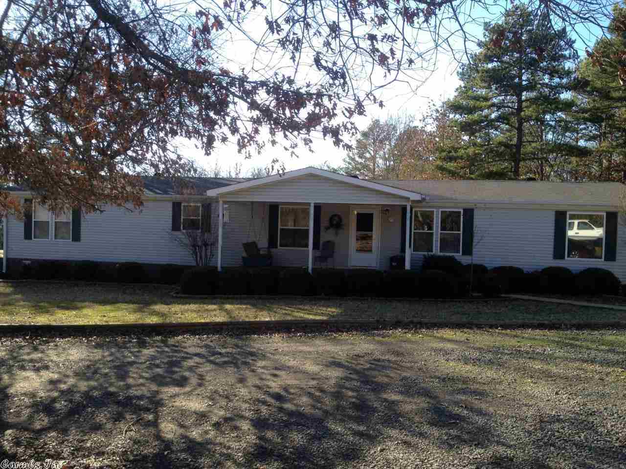 This is a very nice 4 bed, 3 bath doublewide w/ 1976 sq/ft & 11.46 acres. The property is mostly wooded with a pond behind the house & the owners have built a raised & fenced garden spot. The 24ft x 24ft 2 car garage is great for all your storage needs. There is also a front porch, & a back & side porch to sit on & enjoy all the wildlife. The home features 2 living areas, a formal dining area, a huge walk-in closet & a separate tub & shower in the master. Hey Fisherman, Lake Barnet is only 1 mile away!!!!