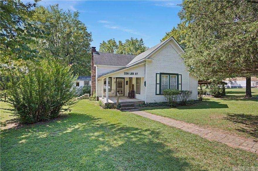 Quaint farm house Situated on 80 +/- acres near town. This 3-bedroom, 1.5-bath home is just 2 miles from town. The property offers the rare convenience of city sewer, city water, and electricity while providing expansive acreage for unmatched privacy and future use. Features include a large barn, a beautiful running creek along the far end of the property, and abundant amount of pasture land great for cutting hay or letting your cattle or horses graze. This property has a perfect amount of woods to be able to hunt right off your back porch or walk down to the creek and catch fish all day! Schedule a appointment and see this once in lifetime property for yourself.