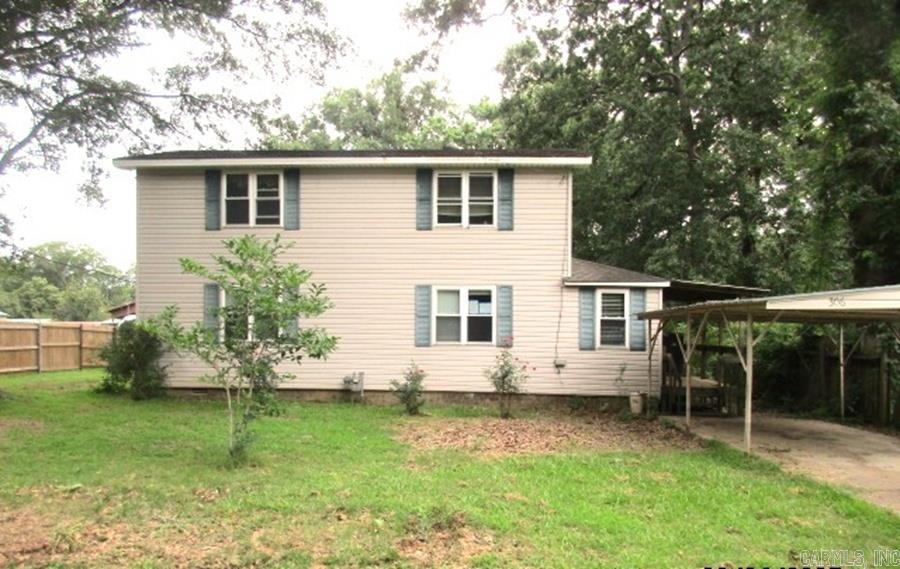 Two story home with 2 bedrooms up and 2 bedrooms down. This home needs some tlc and you can give it all your personal touches. **Agents See Remarks**