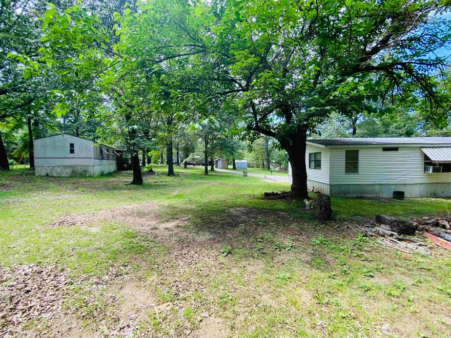 Multi-Home Residential Investment Opportunity on 2 +/- Acres  This unique property offers excellent income potential with three separate living units on approximately 2 acres.  Unit #1: 3-bedroom, 1-bathroom home with 1,176 sq ft of living space.  Unit #2: 3-bedroom, 2-bathroom single-wide mobile home, 1,280 sq ft.  Unit #3: 3-bedroom, 2-bathroom double-wide mobile home, approximately 1,200 sq ft.  Whether you're looking to expand your rental portfolio or establish a commercial venture, this property provides versatility and value in a high-demand area—all for just $135,500!