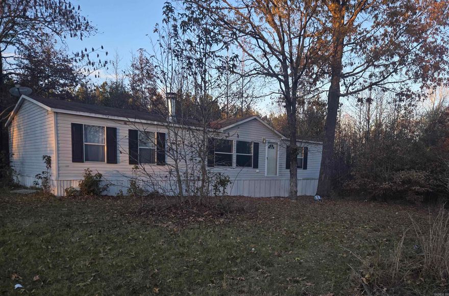 Nestled in a quiet, rural setting, this well-maintained manufactured home sits on approximately 2 beautiful acres, offering the perfect blend of privacy and space. Surrounded by mature trees and natural scenery, this property provides a serene escape while still being conveniently located to nearby amenities.  The home features a functional layout with comfortable living areas, abundant natural light, and a welcoming front entry. Outside, the expansive acreage offers endless possibilities—gardening, recreation, outdoor entertaining, or simply enjoying the tranquility of country life. There’s plenty of room for animals, a shop, or future improvements.  Whether you’re looking for a primary residence, a weekend retreat, or an investment opportunity, this property delivers space, potential, and peaceful surroundings at an affordable price. Don’t miss your chance to own acreage with room to grow—schedule your showing today!