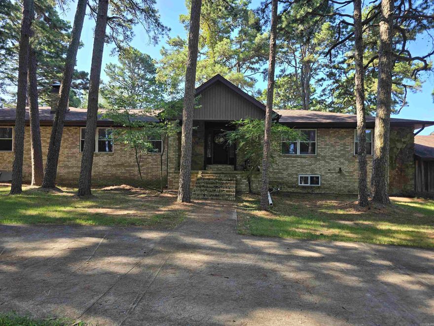This beautiful 11.57-acre property is fully fenced with a 59'x93' barn, a 40x40 pole shed and 10x22 pole shed. This amazing property also features a 4088 sq ft split level home with 1728 sq ft of basement space! This home is full of opportunities with so many multi-purpose areas, the possibilities are endless. The home has 3 kitchen areas, two living areas, office space, dinning space and plenty of room for a game room, media room or anything else you may need or want. There are currently 4 bedrooms, 3 full baths, and 2 half baths. Carports are located on both ends of the home and a single car garage on one end. You can entertain on the spacious covered back porch or in the 312 sq ft sunroom or just relax in front of the fireplace. There are too many wonderful features to mention so come see this rare find today! Additional acreage available!