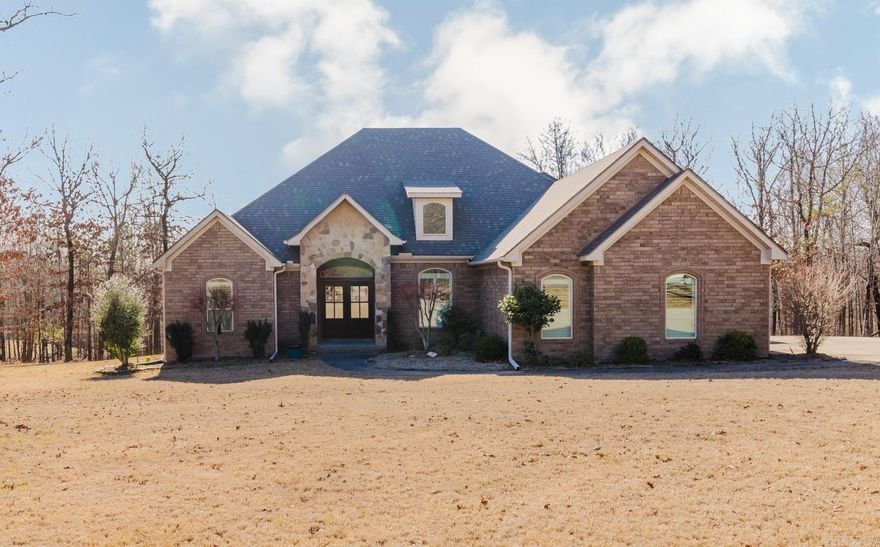 Set on 2.98 partially wooded acres in a beautiful gated neighborhood, this exceptionally maintained 4 bedroom, 3 bath, one-level home offers the perfect balance of privacy, space, and comfort.  A desirable split floor plan provides added functionality, including a Jack-and-Jill bathroom connecting two secondary bedrooms.  Rich hardwood floors, soaring ceilings, and elegant crown molding create a bright, inviting interior, while the open-concept layout flows seamlessly into a well-appointed kitchen for everyday living and entertaining.  Step outside to your own private retreat, featuring a covered gazebo/pavilion with a stunning stone fireplace, perfect for year-round gatherings and relaxing evenings.  The expansive acreage offers a peaceful, wooded backdrop while still providing usable outdoor space.  Additional highlights include a three-car garage plus an additional detached garage/workshop, offering excellent storage and flexibility.  Some photos have been digitally staged.