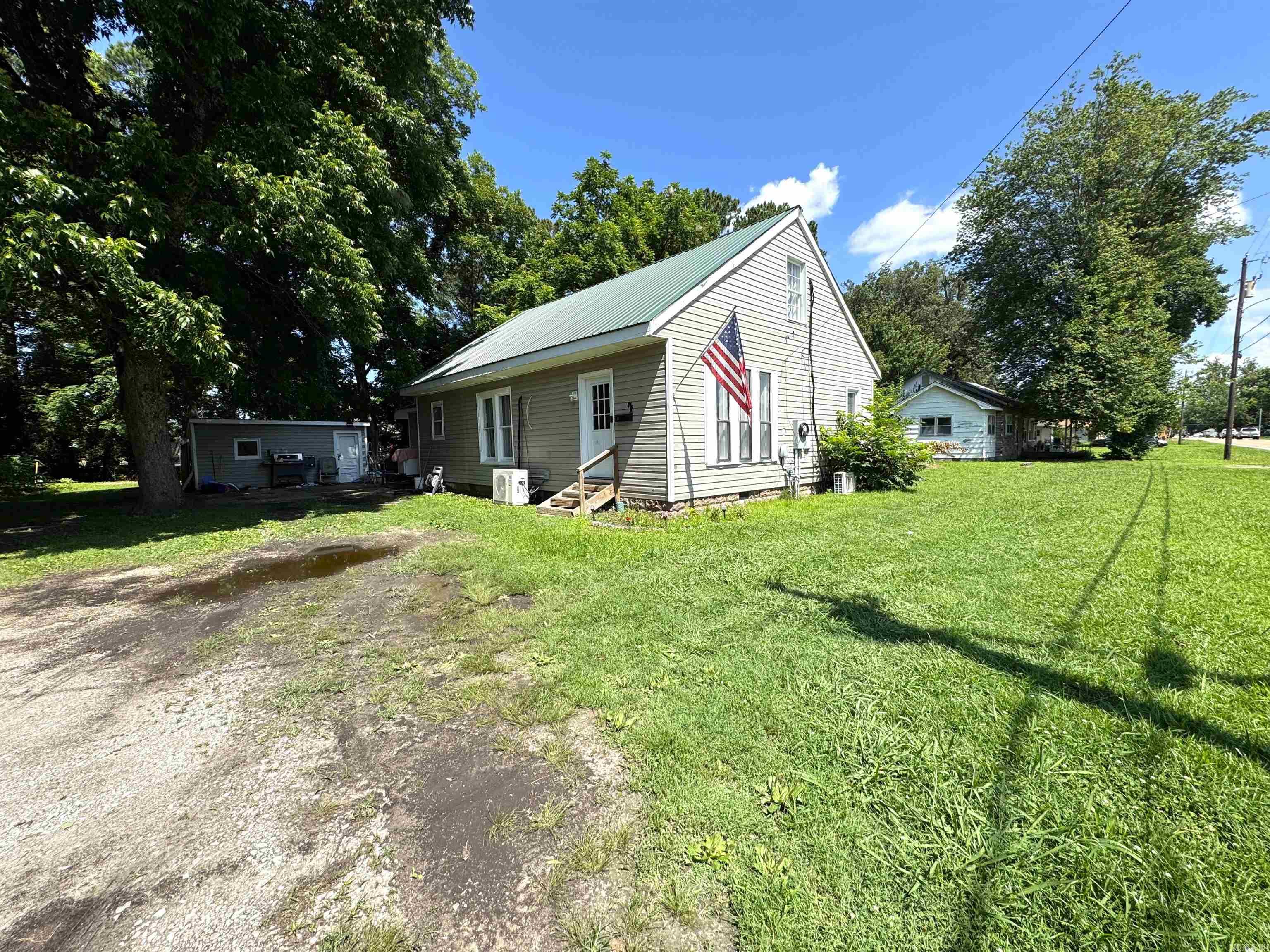 731 S. Thornton Ave. in Piggott, AR 72454 is a 3 BR, 2.5 BA, 1,668 SF home that was built in the mid 90's. It is sitting on a 0.28 Acre lot, which is ample space for a fenced yard or a garden. An outdoor storage building is also included with the property. The property features a large, light-filled living room, a separate dining-bonus room, a practical mudroom with separate laundry room, which includes the half bath. This home has great natural lighting and a functional floor plan with the primary suite located on the main level. The second story houses the guest bedrooms. This is a solid home for buyers or investors! Call/text me today to schedule your showing!
