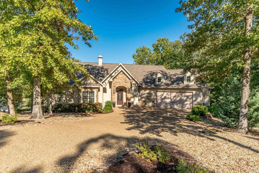 Exquisite Custom Home by Ben White with Golf Course and Water Views - Step into timeless elegance with this beautifully appointed custom residence crafted by renowned builder Ben White.  Nestled along the scenic fairways of the Isabella Golf Course, this 3-bedroom, 3-bath masterpiece built on a .63 lot offers great views of hole #6 - a stunning par 4 framed by a water feature.  Inside, you'll find high-end finishes throughout, including rich hickory flooring, volume ceilings, crown molding and an impressive stone fireplace with built in framed TV.  The central kitchen features a premium Thermador cooktop and an abundance of custom cabinetry providing lots of storage.  The entry level includes two bedrooms, a sunroom, small office, large laundry room, and covered deck with trek flooring for outside enjoyment.  Downstairs you'll find a game room, family room, 3rd bedroom with full bath; and covered patio. (See floor plan for full details) Whether you're entertaining friends/family or just enjoying the golf views, this home delivers luxury living at its finest!   Don't miss your chance to own this exceptional property in Hot Springs Village!  See Agent Remarks for more details.