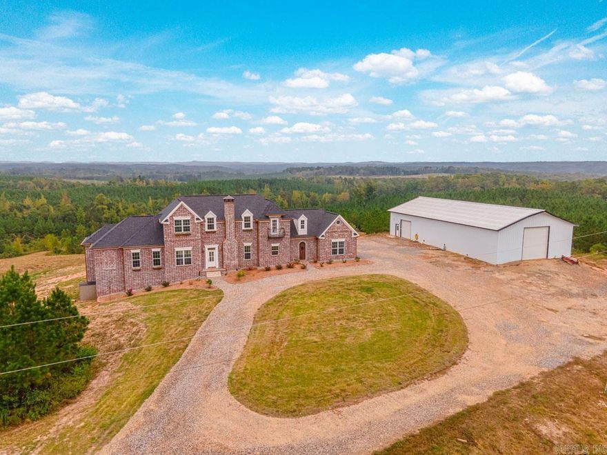 88 private acres and mountain views you would never expect this close to town!  Property has a 40x80 shop w/1000sqft being heated/cooled, equipped w/plumbing, 240v electric, hot water, and wired fiber internet.  Home has a bonus room (500sqft) upstairs that is not included in sqft & an oversized (798sqft) garage.  First-floor master has on-suite laundry, plus there’s a second laundry room upstairs.  Kitchen boasts 2 dishwashers, 2 refrigerators, double ovens and large pantry.  Cat 6 ethernet wiring, alarm system, surround sound, water softener, hot water recirculating system & 4-zone HVAC.  House has abundant shelving, closets, and storage space, as well as a secret room and separate secret passageway.  There’s a custom-made chicken coop w/water & insulated well house.  You'll love the peace & quiet and exploring the trails & two creeks that run throughout! See 'Home Features' handout & Agent Remarks.