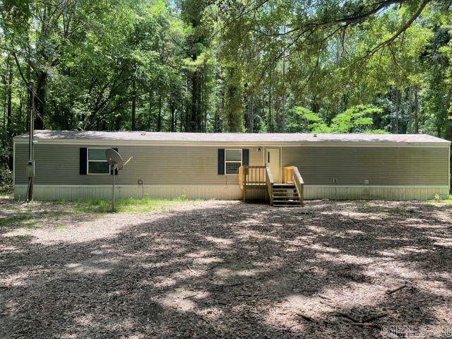 Charming 3-Bedroom Manufactured Home on Nearly 5 Acres in Ashley County! Welcome to this 2021-built, move-in-ready 3-bedroom, 2-bath home situated on approximately 4.98 acres in the peaceful countryside of Montrose, AR. Featuring 1,216 sq ft of comfortable living space, this home offers an open-concept layout, spacious kitchen and living areas, and split-bedroom design for added privacy. Enjoy the quiet of rural living while still being easily accessible via Highway 82. The property offers plenty of room for gardening, recreation, or even future expansion. Whether you’re looking for a starter home, investment property, or a serene place to retire, this property fits the bill. this property will not subdivide and offers a great opportunity for those seeking space, value, and modern convenience. Don’t miss out – schedule your private showing today!