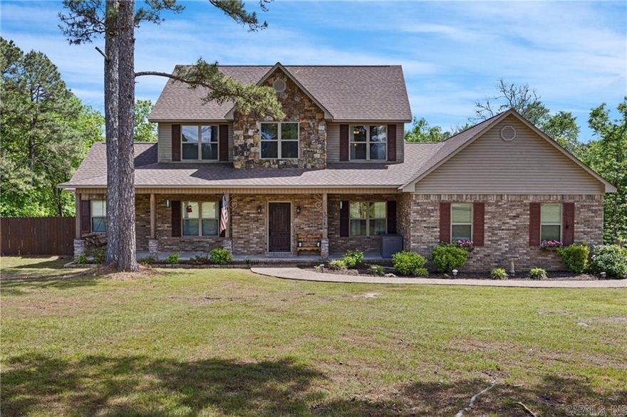 On the Bluff overlooking a Lovely flowing creek, you’ll find this elegant brick and rock two story, custom built home with 3 sunny bedrooms, each with its own bath, also a 4th bonus room. The largest suite is located on the lower level of the home with a luxurious bath, clawfoot tub and walk in shower & closet. There is formal dining and an eat in kitchen with bay window overlooking your brick covered patio. This beautiful home offers two living rooms. Located in the oversized garage is a storm shelter. There are two outbuildings and a garden area. Also, solar panels to help with keeping your utilities low. Unbelievable 11 luxurious acres with a rolling Creek, Swimming whole, Rock formations, large trees with serenity at its best yet only 5 1/2 miles from Clarksville city limits. Outside privacy fence, dog pen area. the property has been surveyed. Just minutes from Clarksvilles trails and Lake Ludwig. Nice ATV trail going to your very own creek on east side of property. Survey available, No Restrictions on the land