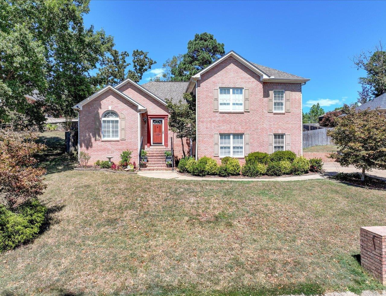 This two-story home in the Saint Charles neighborhood is just minutes from Hot Springs Golf and Country Club. Sitting on a beautifully landscaped lot, it features a spacious layout with a great room, kitchen, and breakfast area. The great room has a cozy fireplace, hardwood floors, and built-in cabinetry, while the kitchen offers plenty of space, including a large center island with a breakfast bar. Upstairs, you’ll find three bedrooms, including a primary suite with French doors leading to a large deck. The lower level provides a second living space or family room with a private full bath. Agents: Call Showing Service to schedule all showings.