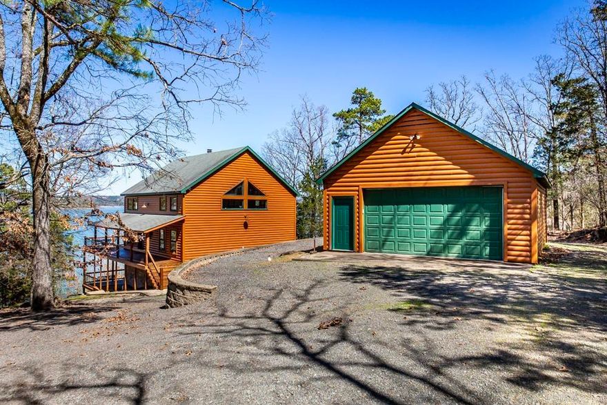 Indulge in the epitome of lakeside luxury with this breathtaking cabin, perfectly positioned along the tranquil shores of Greers Ferry Lake. With ample space to accommodate up to 12 guests, this retreat promises unforgettable gatherings & cherished memories. Step inside to discover a stunning wall of windows, stone fire place, & wood ceilings that create an atmosphere of timeless charm.  3 different living areas for families and friends to enjoy some quiet time. Venture out onto the wrap-around deck to soak in panoramic views of the serene surroundings & watch the eagles. Steps to the water. This exquisite cabin comes FULLY FURNISHED ensuring convenience & comfort at every turn. Entertain with ease w/ two ice makers, while peace of mind is guaranteed with a gated entrance & comprehensive security system in place. Conveniently located just 4 miles off Hwy 65. Accessibility meets seclusion in this idyllic retreat. Additionally, a 24' x 28' shop provides ample storage for all your lake toys, with a boat launch just moments away, beckoning adventures on the water.  Don't miss your chance to experience lakeside living at its finest – seize this opportunity. See agent remarks.