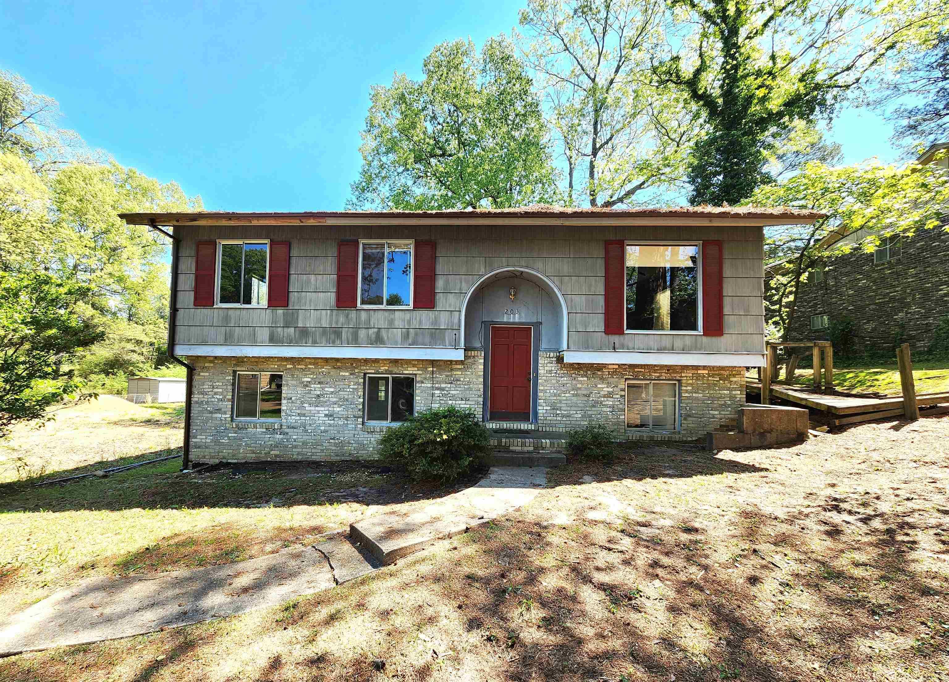 Attention Investors! If you have been looking for a fantastic investment property.. this is it! This 4 bedroom, 2 bath brick home is spacious and has so much potential. **Sold As-Is, this home will not qualify for VA, FHA, or USDA loans. The vacant lot next door is not a part of this property. CAUTION- Please do not walk on the deck or wood walkway- as this area is in deteriorated condition!