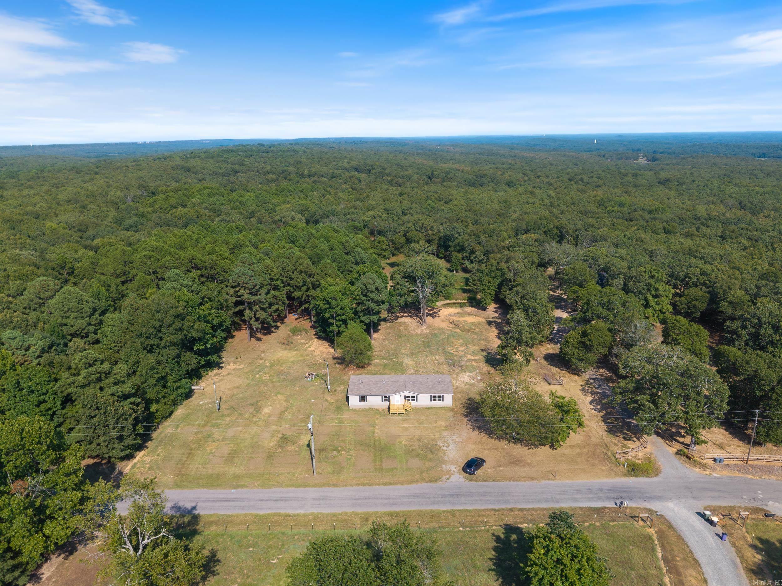 Completely remodeled 4-bedroom, 2-bath, 1,800+ sq ft mobile home on a permanent foundation, with over 8 acres of both cleared and wooded land. Enjoy a spacious open and split floor plan, a beautiful butcher block countertop, and brand-new appliances including a dishwasher and stove. Other updates include fresh paint, new flooring, and updated fixtures throughout. Relax on the newly built large decks at the front and back of the home while taking in the peaceful surroundings. Contact us today for more information!
