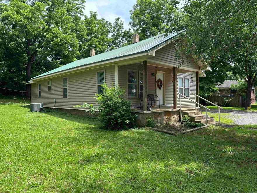 This recently renovated 3-bedroom, 2-bath home is located within the city limits of Marshall, Arkansas. Offering approximately 1,245 square feet of living space on a surveyed 0.16-acre lot, the home features central heating and cooling, a cozy fireplace insert, a dedicated laundry room, and a durable metal roof with low-maintenance vinyl siding. With its updated interior and convenient in-town location, this move-in ready property is ideal for comfortable everyday living or as an investment opportunity.