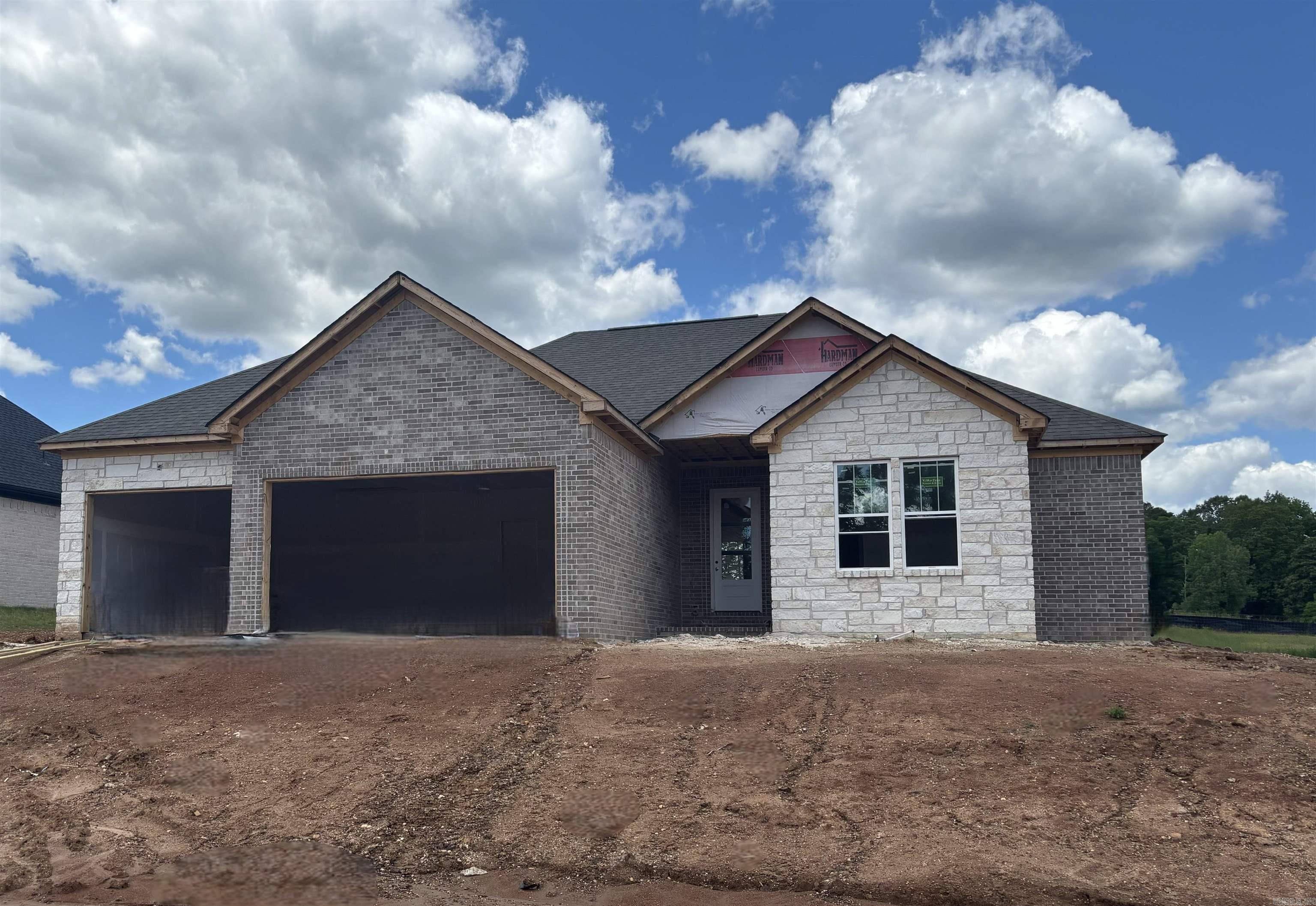 THREE CAR GARAGE!!! Large covered back porch, extra landscaping. LVP flooring , custom cabinets with large island, wall oven, gas cooktop. butler pantry, also regular pantry. Primary has tile shower with separate tub, large closet.