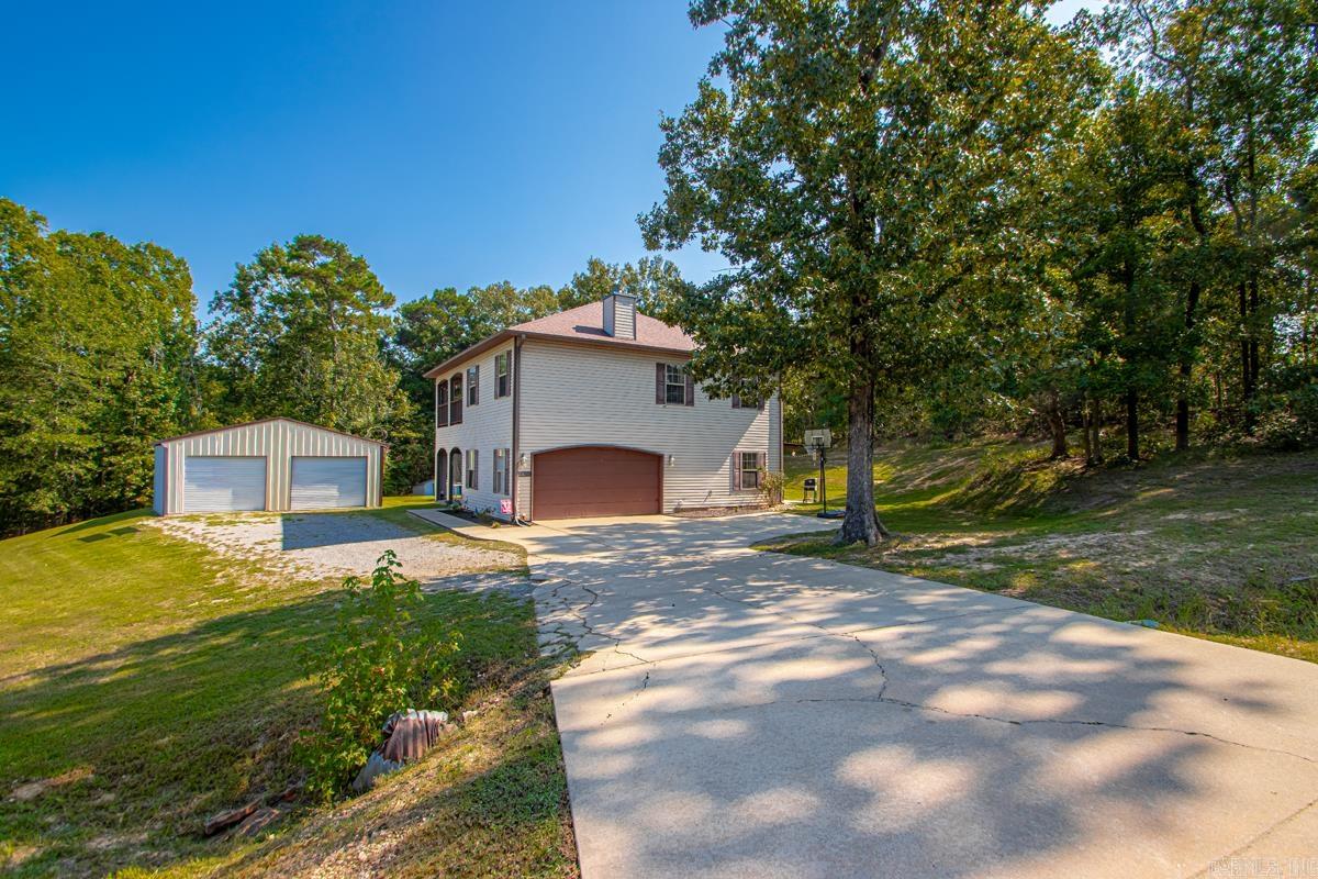 This beautifully updated home on 1.16 acres offers the perfect mix of comfort, function, and charm. Outdoor sitting areas are accessible from nearly every room, creating a true connection to the surrounding property. A 30x30 shop features a 4-inch slab, 4 inches of insulation, red iron beams, and two 10-foot roll-up doorsāideal for storage, projects, or hobbies. Inside, the versatile fourth bedroom with fireplace can serve as a cozy office, playroom, or guest suite. All bedrooms are located upstairs, with two dining areas for easy entertaining and a private balcony off one of the bedrooms for a quiet retreat. Just a short drive to Little Rock, this home combines country living with everyday convenience.
