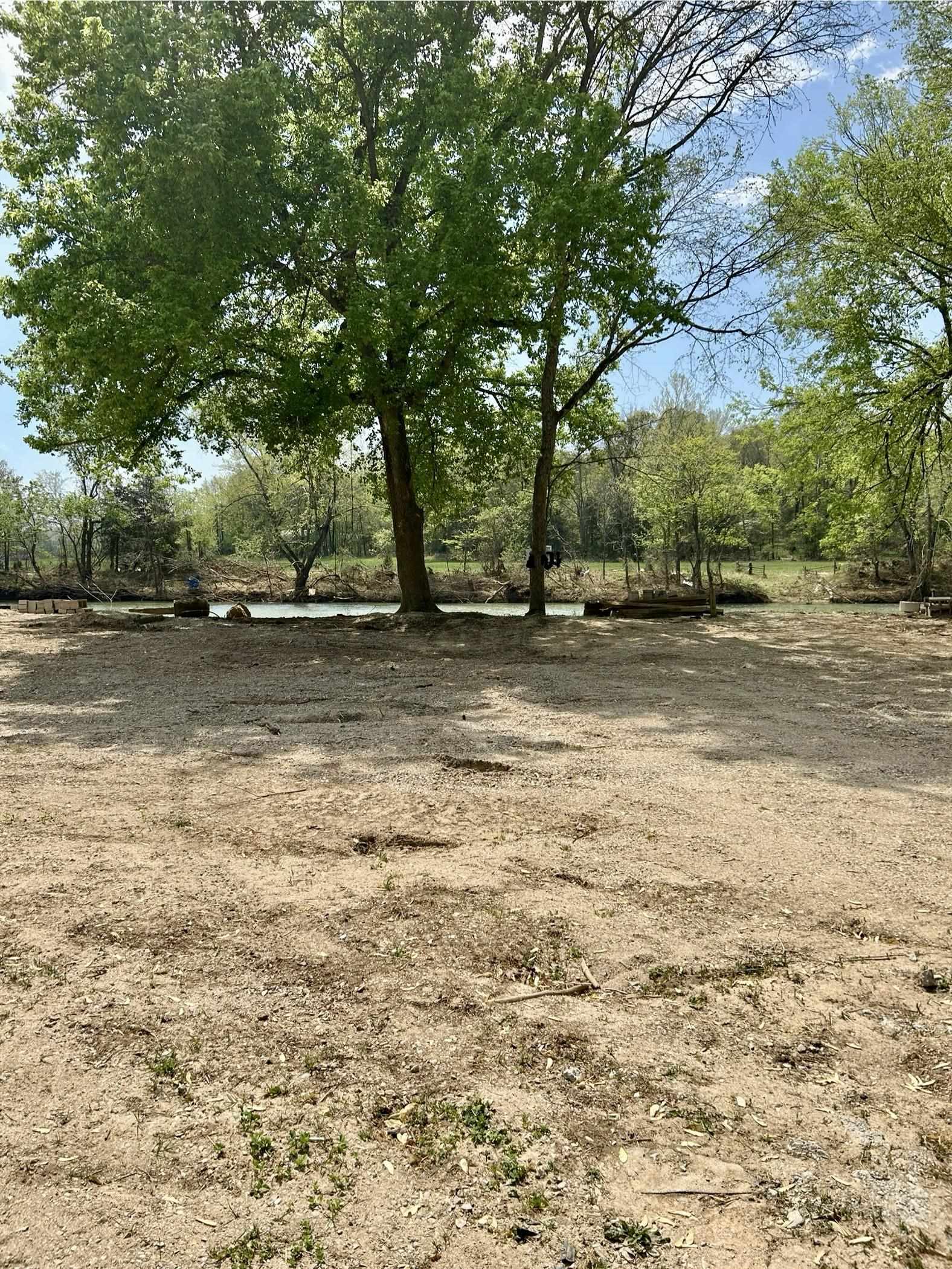 Camper lot on Spring River in a gated park with park water on lot and electric at road. The park has a swimming beach along with a swimming pool and a boat launch