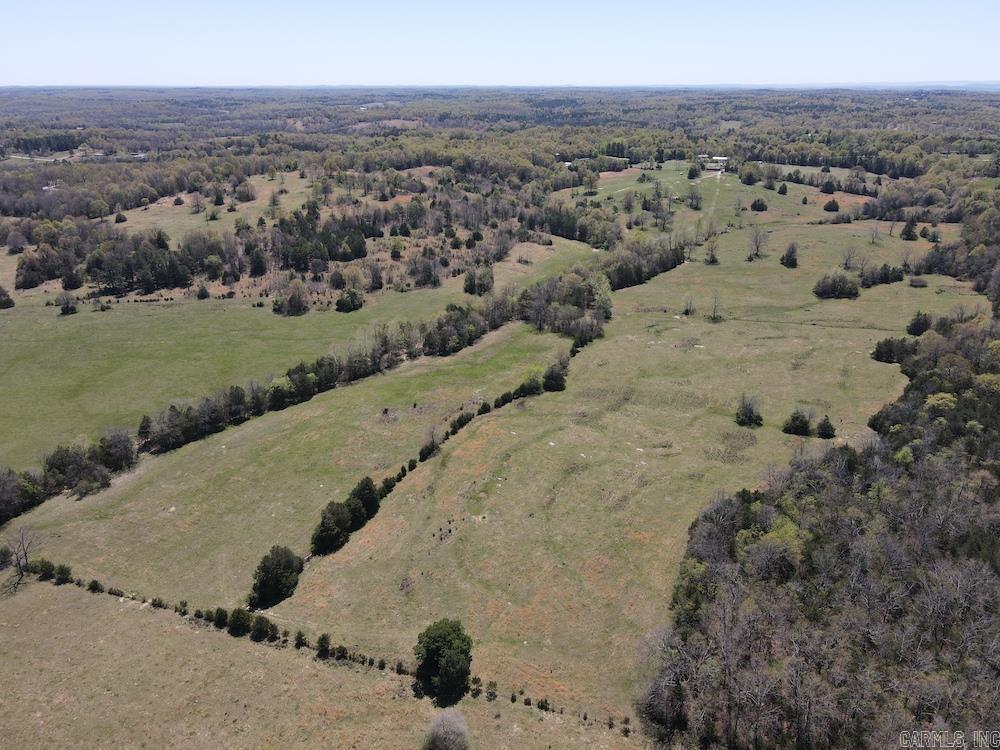 This rare and versatile property near Melbourne, AR offers lush, rolling cattle ground with premium grasses, abundant water, and prime hunting. Featuring highway frontage, multiple building sites, and city utilities (water, sewer, electric), itās ready for your dream home or farm operation. A spring-fed all-season creek, four additional ponds, and another natural spring ensure year-round water, even during drought. The land has gently rolling topography, perimeter fencing, and some cross-fencing, with areas previously used for hay and winter cattle grazing. A large machine shed offers ample storage. Scattered mature hardwoods provide shade, while sections managed for wildlife create top-tier deer and turkey hunting opportunities, with dense cover and bedding areas. This tract blends beauty, productivity, and recreation, making it ideal for a homestead, ranch, or getaway. An optional 3 bed, 1 bath home on 1 acre is also available. Donāt miss this unique chanceāschedule your private showing today.
