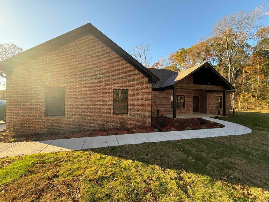 This stunning custom home is a show stopper. Open concept for entertaining. Butlers pantry is right off the kitchen with room for extra refrigerator or stand up freezer. Stunning wood accented electric fire place. Corner lockers from garage entrance for extra storage. Large laundry with extra cabinets and folding table. Master suite features huge walk in shower, soaker tub and large closet with built in dresser. Split floor plan with two additional bedrooms and guest bath.