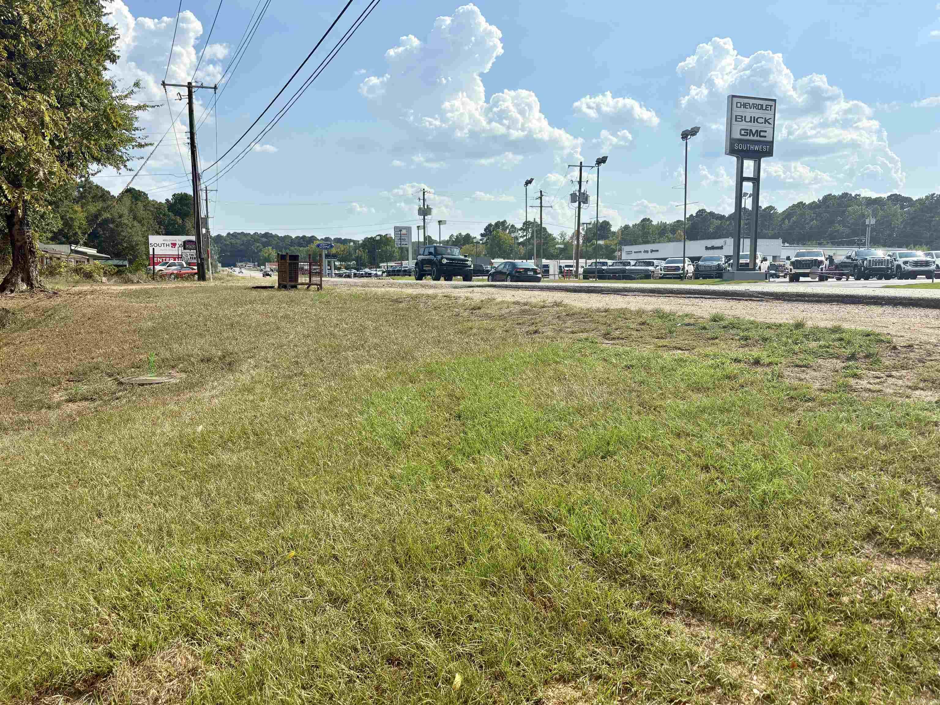 Looking for a piece of commercial property to start a new business? Just under 1.5 acres of commercial land sitting just off the highway of a high traffic area. Great investment property, full of potential for any kind of business! Let your ideas & dreams come to life, lots of potential for any new kind of business with two 4 year universites close by. There are two structures on the property that are no additonal value to the property.