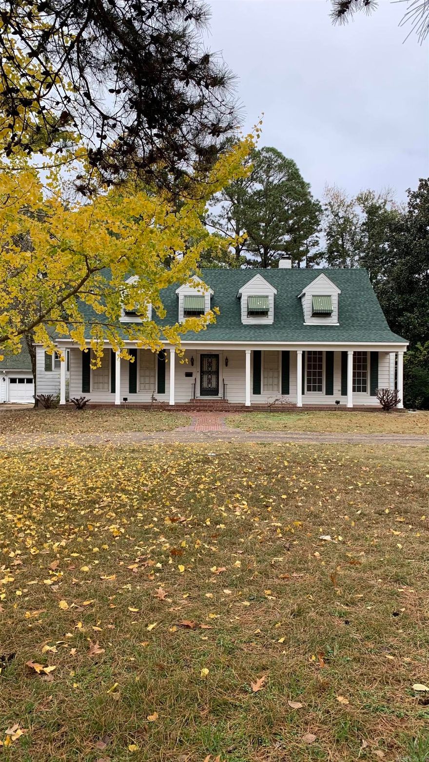 Beautiful historic home on a wonderful large lot with mature trees. This home boasts 4 bedrooms with main bedroom and a second bedroom on the main level, each with its own bathroom. Large living room with hardwood floors and a fireplace. Family room and large laundry room with half bath are on the main level. Brand new roof and front porch. Five car garage with a separate workshop. This beautiful home is ready for you to move in and enjoy.