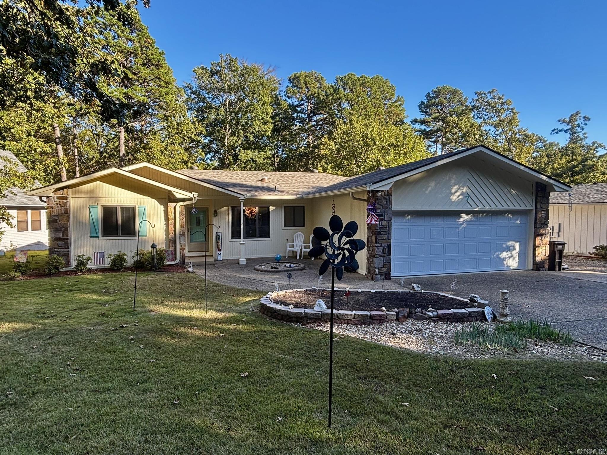 You will love this updated home near the West Gate!  Level lot with common property behind the home,  great quiet neighborhood.  Three bedroom two full baths and two car garage.  You won't believe all the extras in this home.  2019 new 50 gallon hot water heater, 2020 Guest Bathroom new tile, ceiling fan and light 2021. Kitchen new sink and garbage disposal, 2022 luxury vinyl flooring master and 2nd bedroom, 2022 painting kitchen and guest room, exterior painted, new ceiling fans master and 2nd bedroom.  2023 new garage door and controller, new kitchen stove, bathroom faucets upgraded.  2024 new roof and skylights/solar tubes, 2024 new heat pump, 2025 new Trex deck. House is wired for generator. There is a one-time $2,000.00 new member buy in fee for new property owners due at closing.