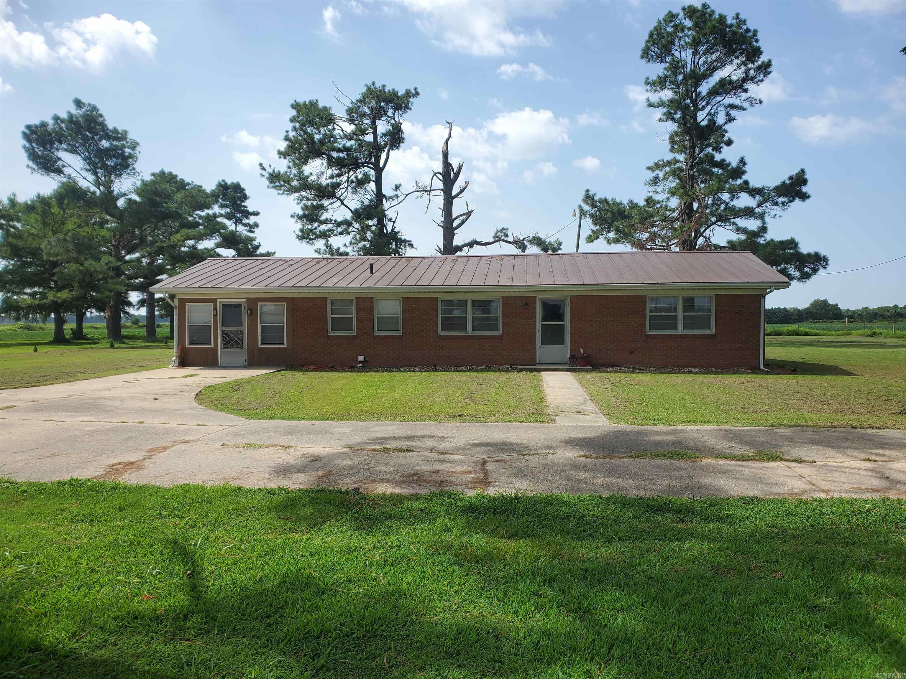 Country Living Close to Town! 1932 Greene 847 Road is a 3-bedroom, 1.5-bath home in Paragould, AR. This spacious home offers 1,566 sq ft of comfortable living space on a peaceful 1.58-acre lot just minutes from Paragould. Enjoy the quiet of the country with the convenience of town nearby. Features include a spacious layout, sunroom, plenty of natural light, and a storm shelter for added peace of mind. Perfect for those wanting space, privacy, and comfort! Call to schedule a showing of this amazing property!
