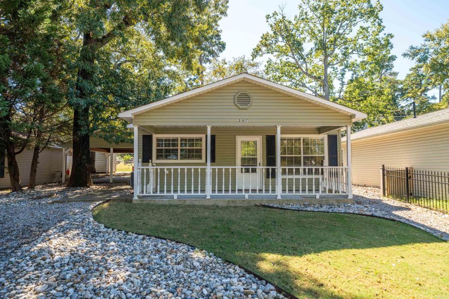 Looking for exceptional value? This home delivers plenty of bang for your buck. The thoughtfully designed floor plan offers a spacious and comfortable living environment, perfect for relaxing or entertaining. A backdoor view of Lake Hamilton—imagine the peaceful water, boats gliding by, and those stunning Arkansas sunsets. Recent updates include new siding, a new dishwasher, and fresh carpet with a premium pet master pad for added durability and comfort. The on-demand hot water heater ensures endless warm showers, and the refrigerator conveys with the home for added convenience. Enjoy the outdoors with access to a nearby trail that leads directly to the lake. The rock-lined back driveway and side yard provide additional parking, making this home both practical and inviting. A smart layout, modern upgrades, and a great location make this home a must-see! This exceptional location also presents an excellent opportunity for either short-term or long-term rental investment.