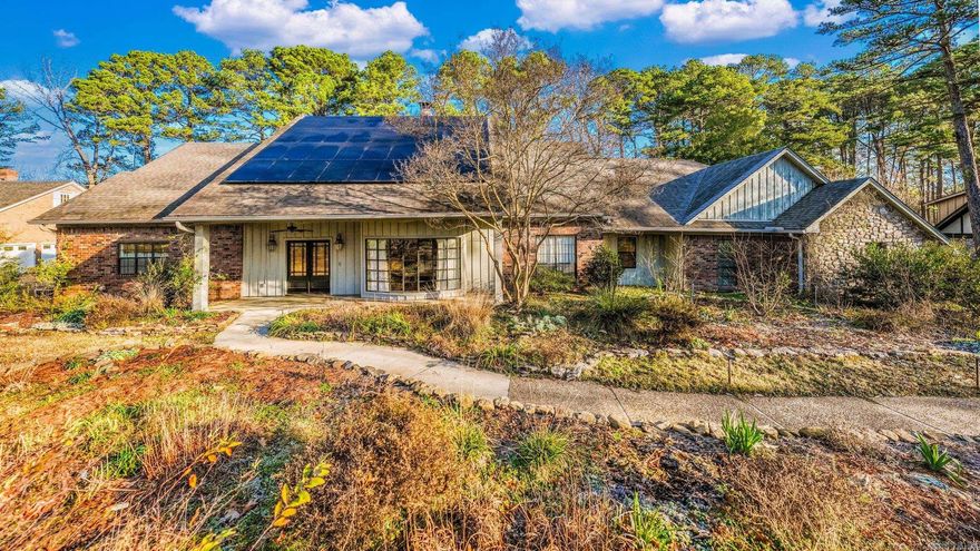 In Maumelle’s historic, original neighborhood, this house has a private cart path to Hole #2 tee box at Maumelle Country Club, spacious areas for entertaining indoors and out, a beautiful pool, and a first-floor primary suite plus 3 more bedrooms upstairs. Watch your energy savings accrue thanks to the solar panels. Enjoy gardening in the easy, raised planting beds. See herons, gulls, and osprey flying above the course. Stroll the neighborhood’s wide network of shady walking paths, save time with the two-minute drive to the grocery, and take advantage of the many amenities of the community centers.