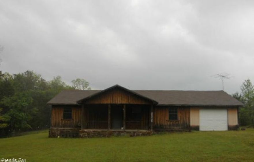 Country living close to town in this rustic frame home on 3.20 acres. This home is move in ready and the front porch is looking for your rocking chair!