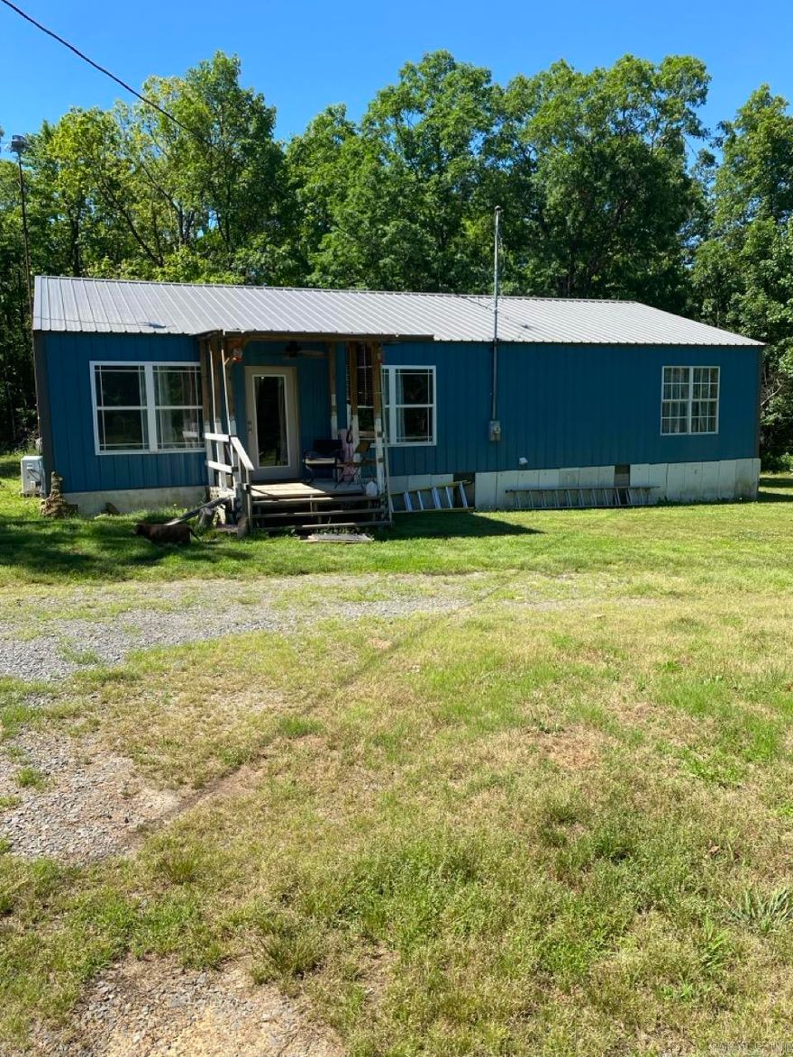 Escape to the quiet beauty of Van Buren County with this beautifully updated 2-bedroom, 2-bathroom home nestled on 5.23 private acres in Clinton, Arkansas. Spanning 1,500 square feet of comfortable living space, this property perfectly blends modern convenience with a rustic aesthetic. Step inside to find a spacious, open-concept layout highlighted by warm, updated finishes that give the home a distinct cabin-like charm. The expansive acreage offers an ideal mix of cleared space and natural wooded privacy, providing plenty of room for outdoor activities, gardening, or a workshop. 2 outbuildings with electric. Conveniently located just minutes from the heart of Clinton and within easy reach of Greers Ferry Lake and the Little Red River, this property serves as the perfect full-time residence or weekend retreat for those seeking space, privacy, and peaceful country living.