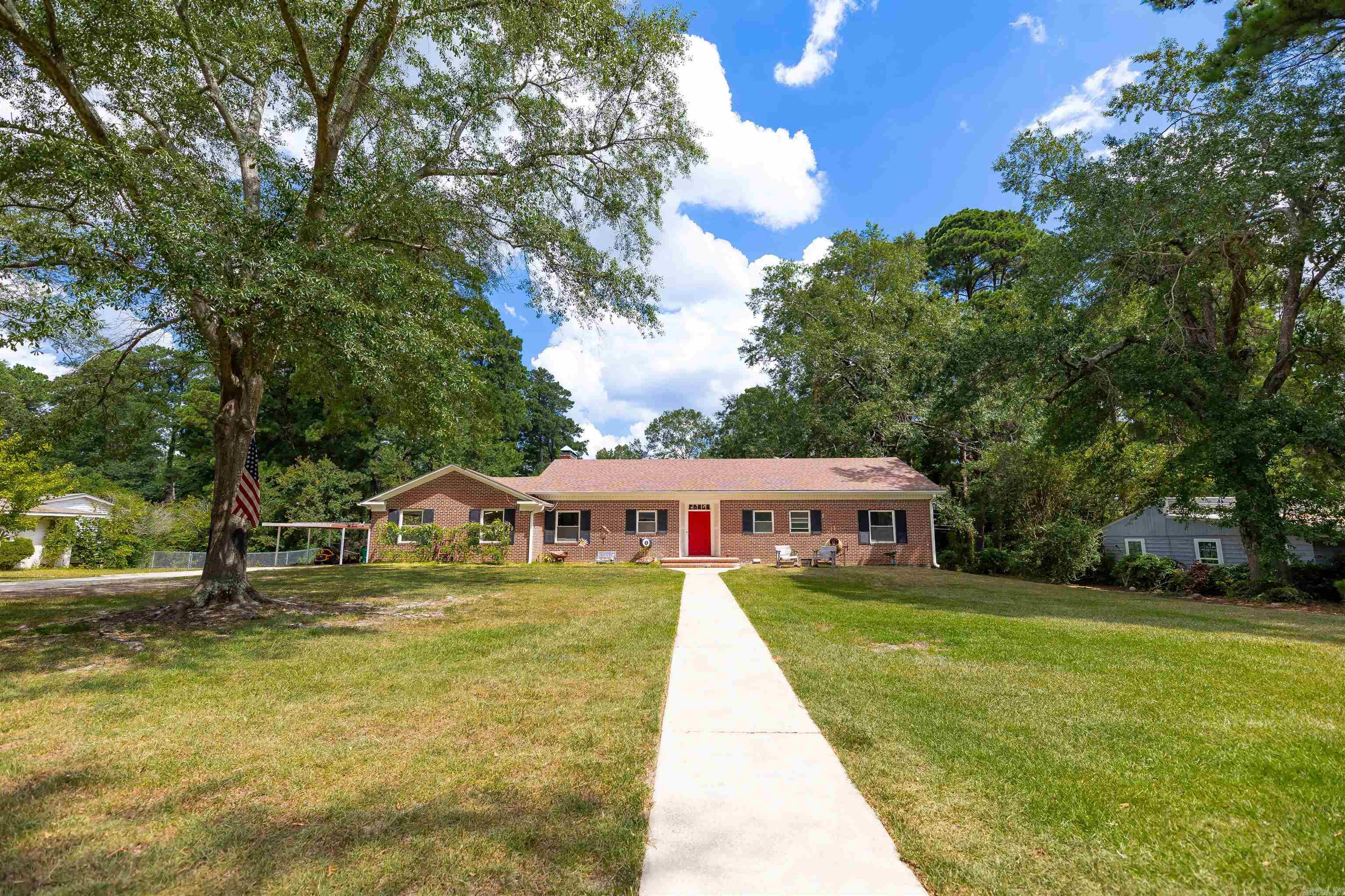 Welcome to this large brick home that honors a nod to vintage charm while inviting modern touches throughout. Located in a uniquely convenient neighborhood, you'll love the privacy and spacious backyard that makes you feel miles from town, and yet situated in the heart of favorite El Dorado amenities. Step inside to find generously sized rooms filled with natural light, creating a warm and inviting atmosphere. Updates to the kitchen feature a fun yet classy color palette with space for a versatile eat-in kitchen. The expansive walk-out basement provides endless possibilitiesāperfect for a recreation area, home gym, or guest suite, complete with a full bathroom with walk-in shower (finishing touches coming soon!). Step outside to enjoy a large backyard and a private patio, perfect for relaxing evenings or weekend gatherings. Don't miss your chance to own this unique and spacious home in a great location!